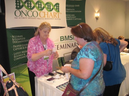 Carol Gravlee(L), OncoChart, with attendees